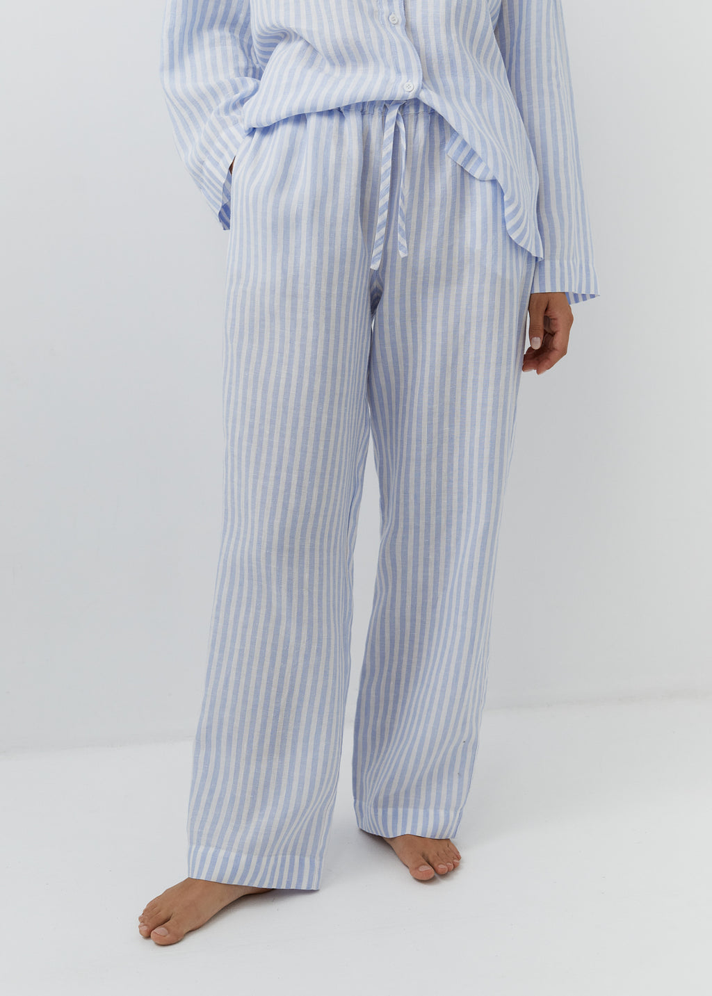 High-waisted striped trousers with an adjustable drawstring waist.