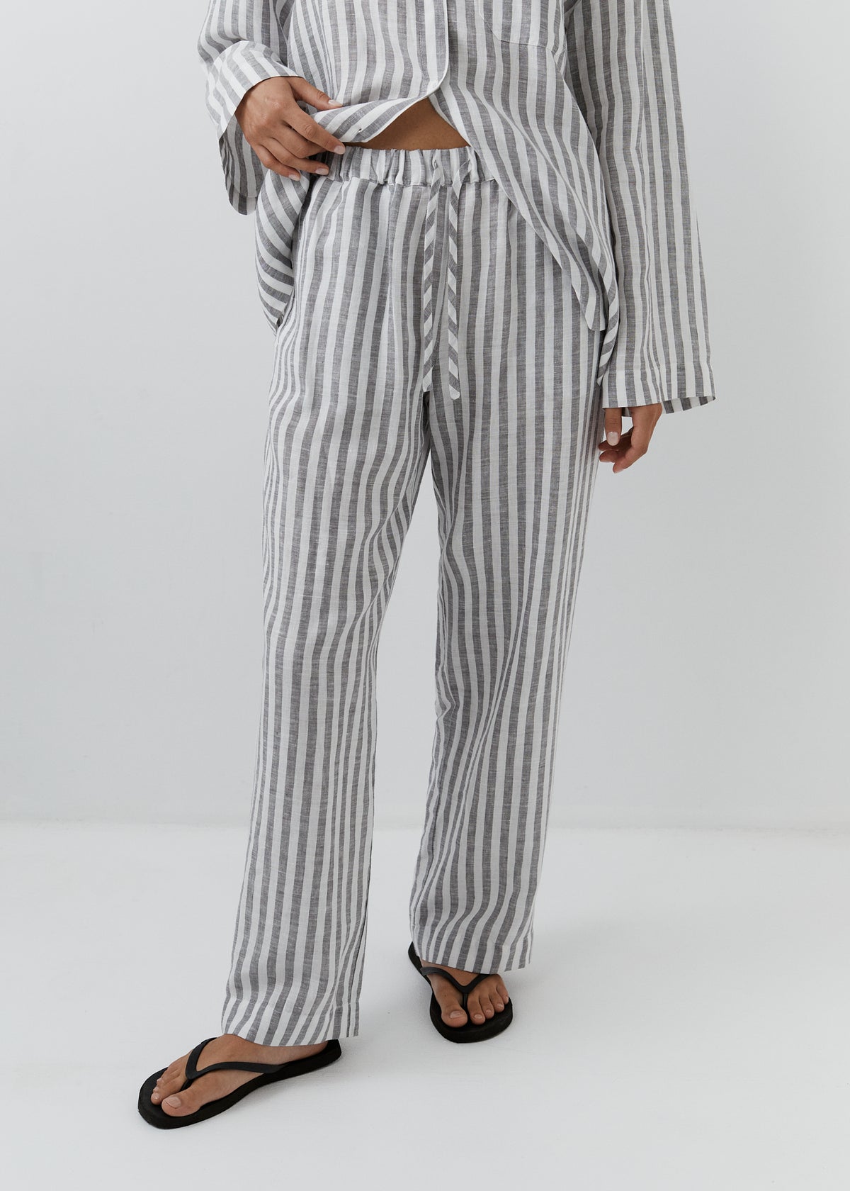 Women’s striped linen pants with an elasticated drawstring waist and straight-leg fit.