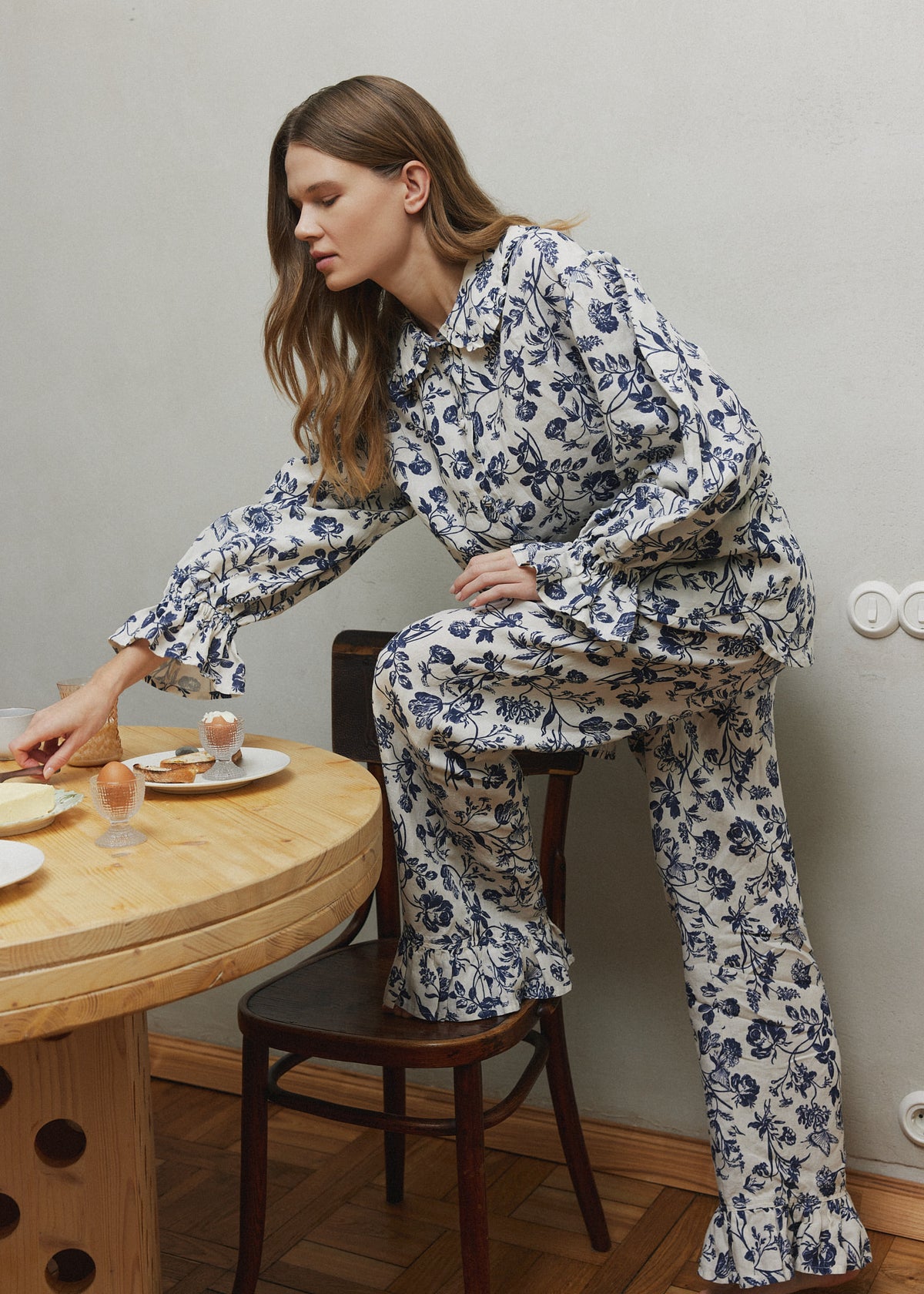 Blue floral print linen sleepwear, a relaxed long-sleeve shirt and flared pants in soft, breathable linen. 