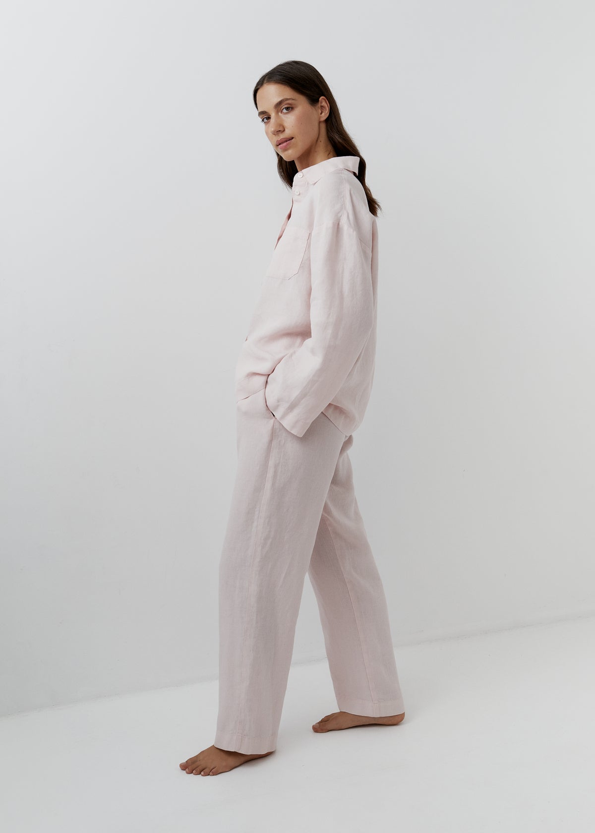 Rose pink linen pyjama set for women with a long-sleeved shirt and relaxed trousers.