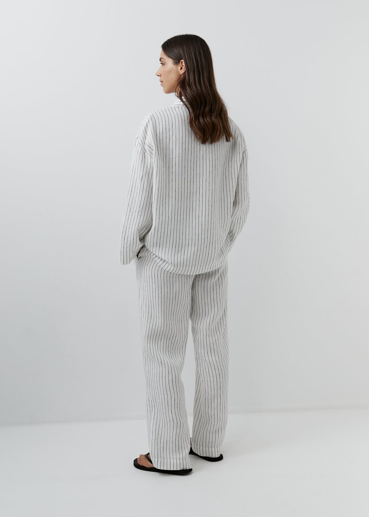 Women’s black striped linen pyjamas with a long-sleeved shirt and high-waisted trousers