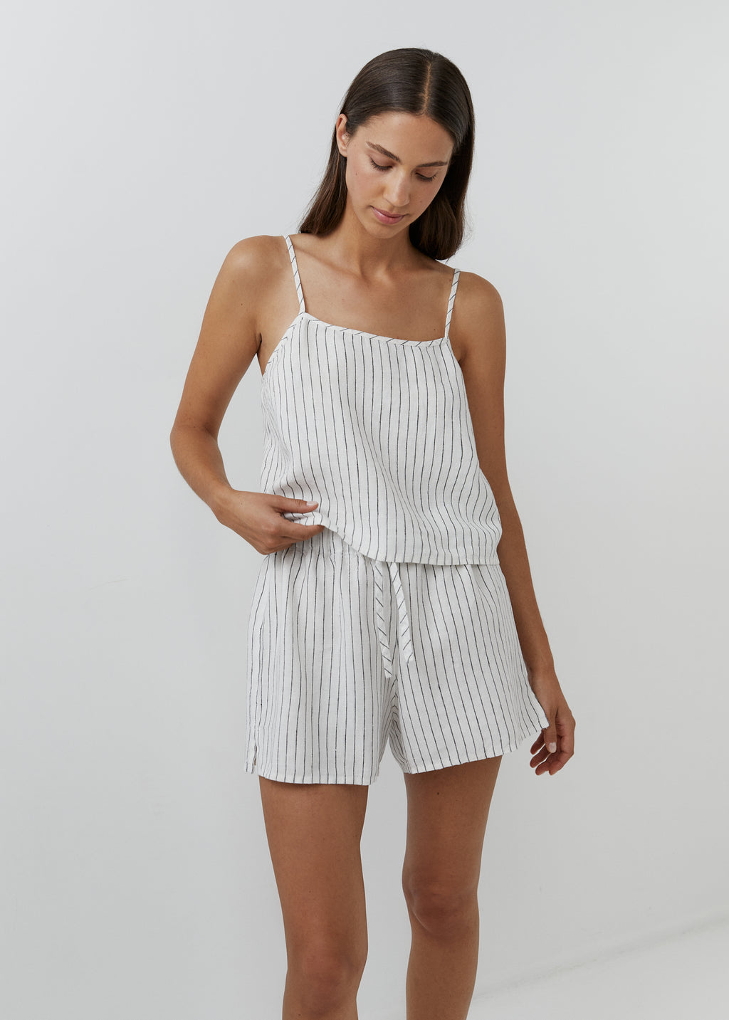Front view of a white and black striped linen camisole top with matching shorts.