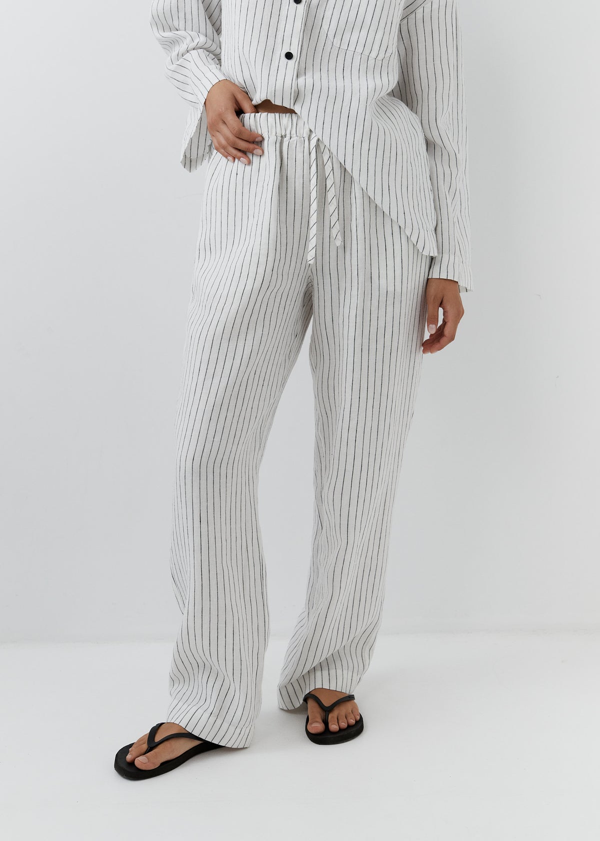High-waisted striped pants with an adjustable drawstring.